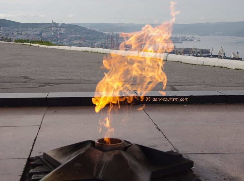 14 - eternal flame over Murmansk harbour, northern Russia