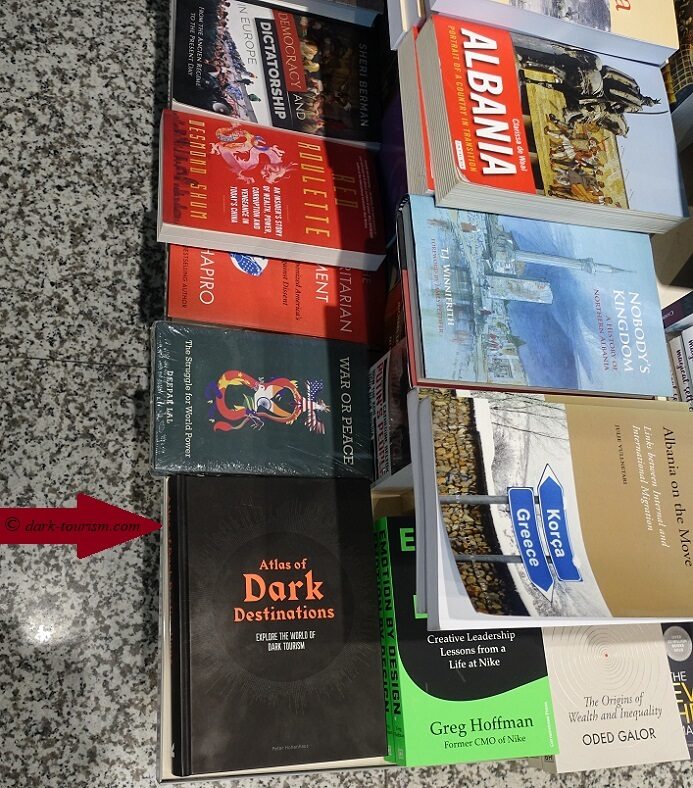 Tirana 22 - my Atlas of Dark Destinations on a shelf at a Tirana Airport book shop